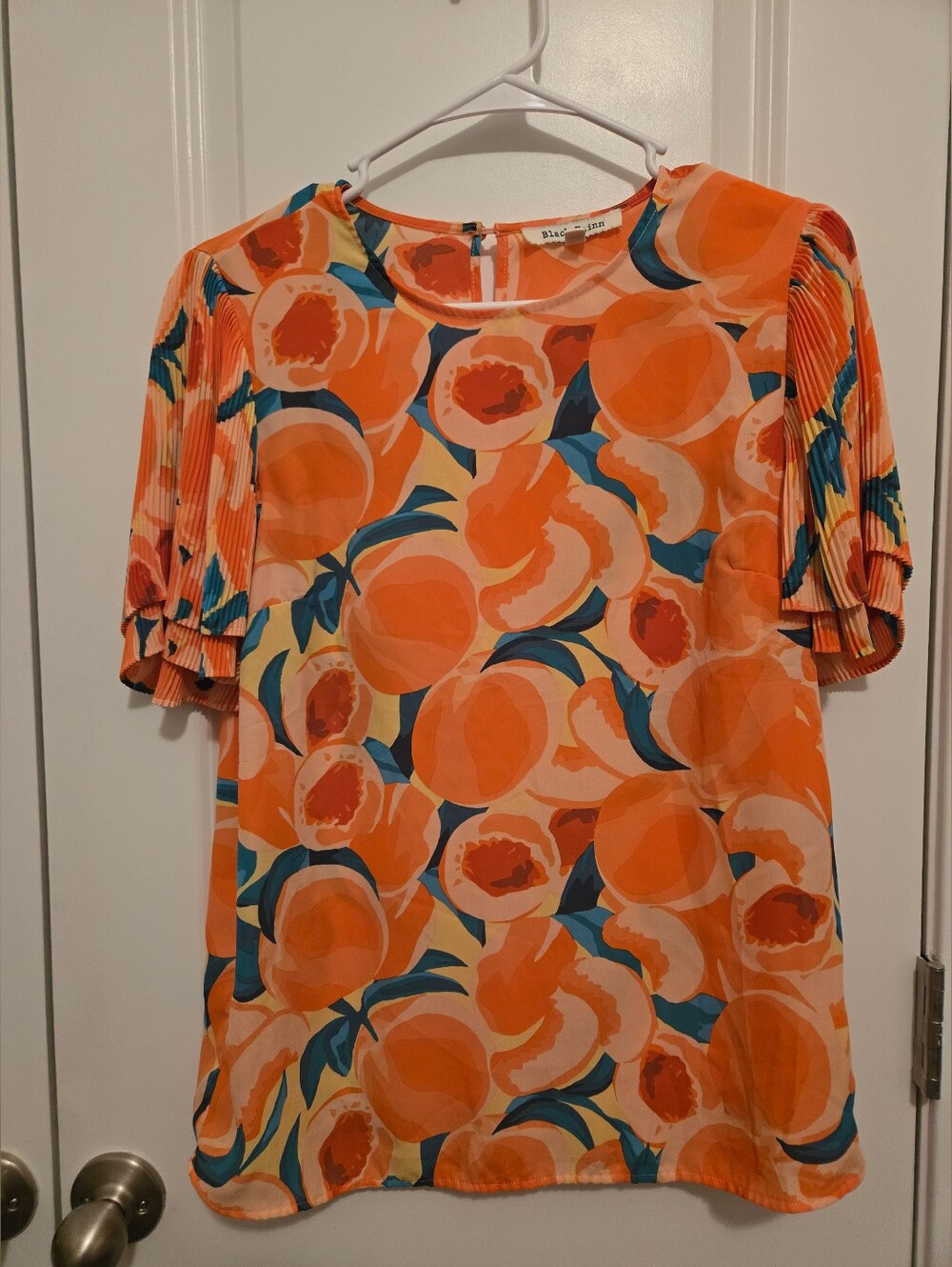 Black Rainn Peaches Ruffle Sleeve Blouse